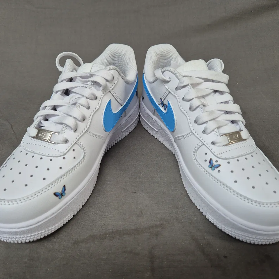 PAIR OF NIKE AIR FORCE 1 SHOES IN WHITE/BLUE W. BUTTERFLY DESIGN UK SIZE 4