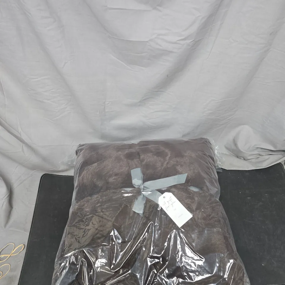 BROWN FLUFFY PILLOWS – WRAPPED IN CLEAR PACKAGING WITH RIBBON