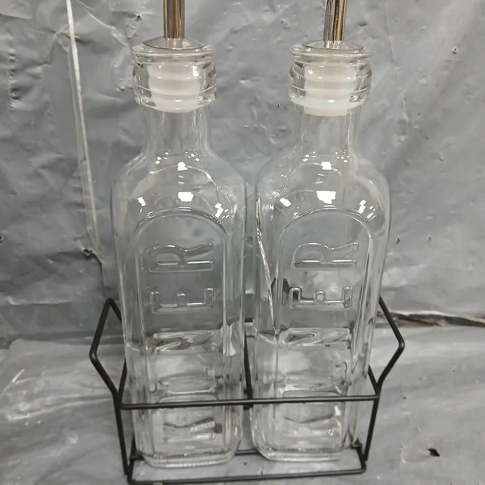 BOXED SET OF 2 GLASS OIL BOTTLES & METAL RACK