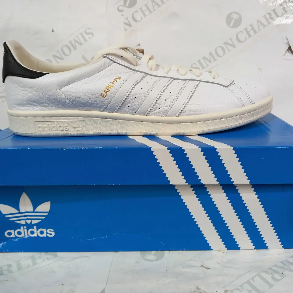 BOXED PAIR OF ADIDAS EARLHAM SHOES IN WHITE/BLACK/GOLD UK SIZE 10.5