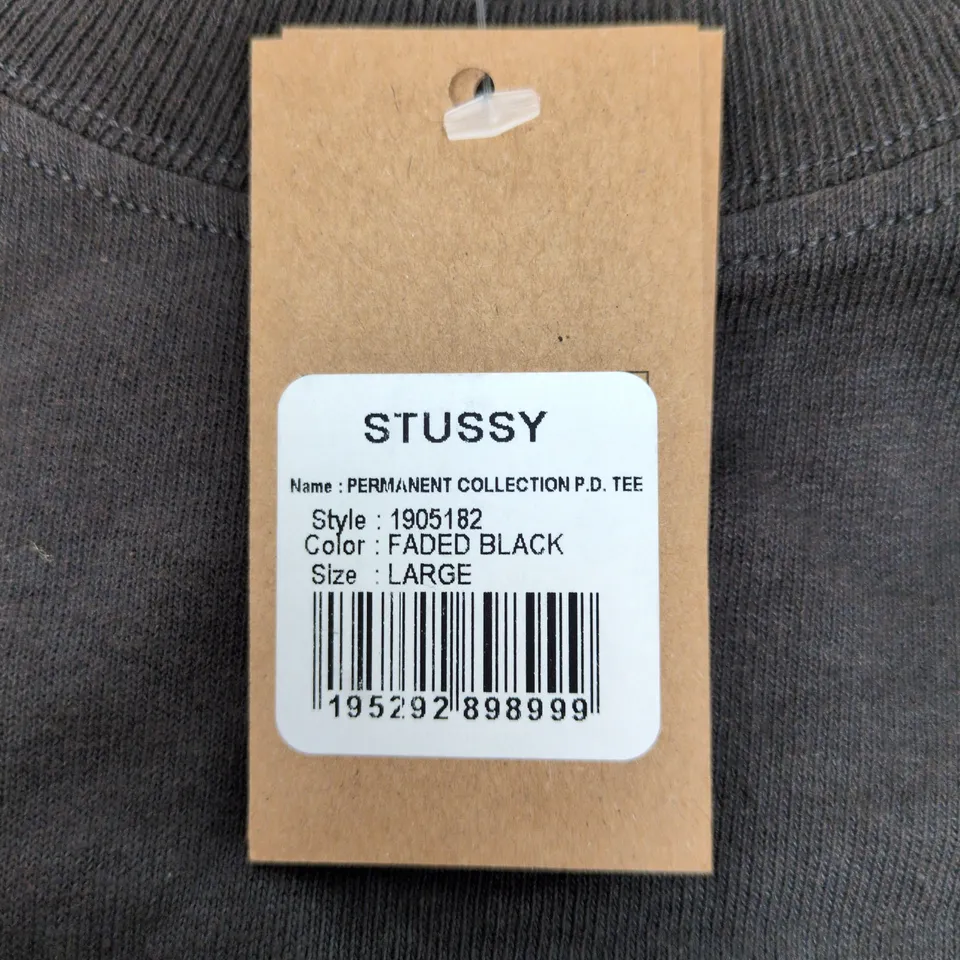 STUSSY PERMANENT COLLECTION P.D. TEE – FADE BLACK, SIZE L (UK L), MADE IN HONDURAS