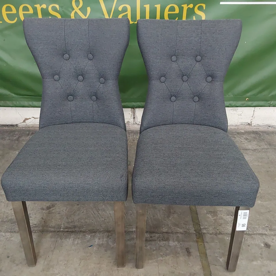 PAIR OF UPHOLSTERED BUTTONED BACK DINING CHAIRS CHARCOAL FABRIC ON SILVERED WOOD LEGS 