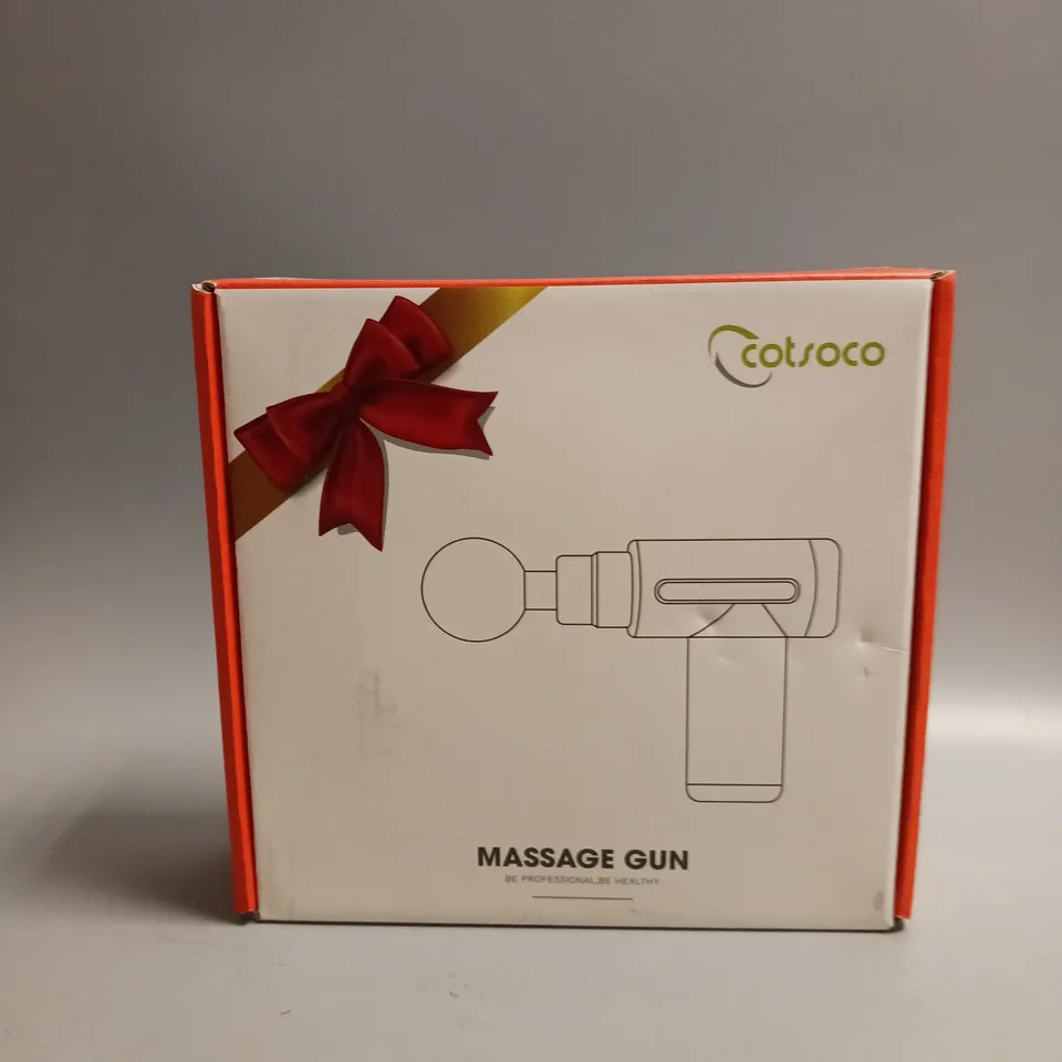 COTSCO MASSAGE GUN IN BLACK WITH GOLD ACCENTS INCLUDES 4 DIFFERENT HEADS AN CHARGING CABLE