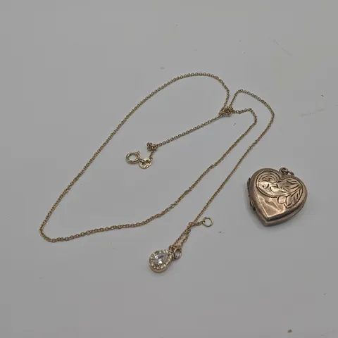 GOLD TONE NECKLACE WITH OPENING HEART PENDANT