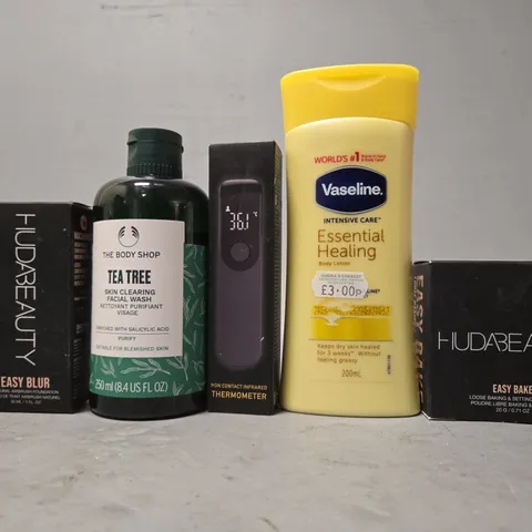 APPROXIMATELY 16 ASSORTED HEALTH & BEAUTY ITEMS TO INCLUDE - VASELINE BODY LOTION , THE BODY SHOP TEA TREE , HUDABEAUTY EASY BAKE SETTING POWDER ETC