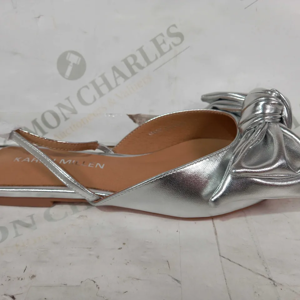 BOXED PAIR OF KAREN MILLEN BOW SLINGBACK POINTED TOE FLAT SHOES IN METALLIC SILVER SIZE 4