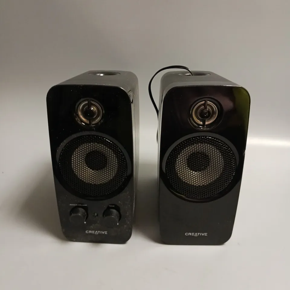 PAIR OF CREATIVE PLUG-IN SPEAKERS IN BLACK