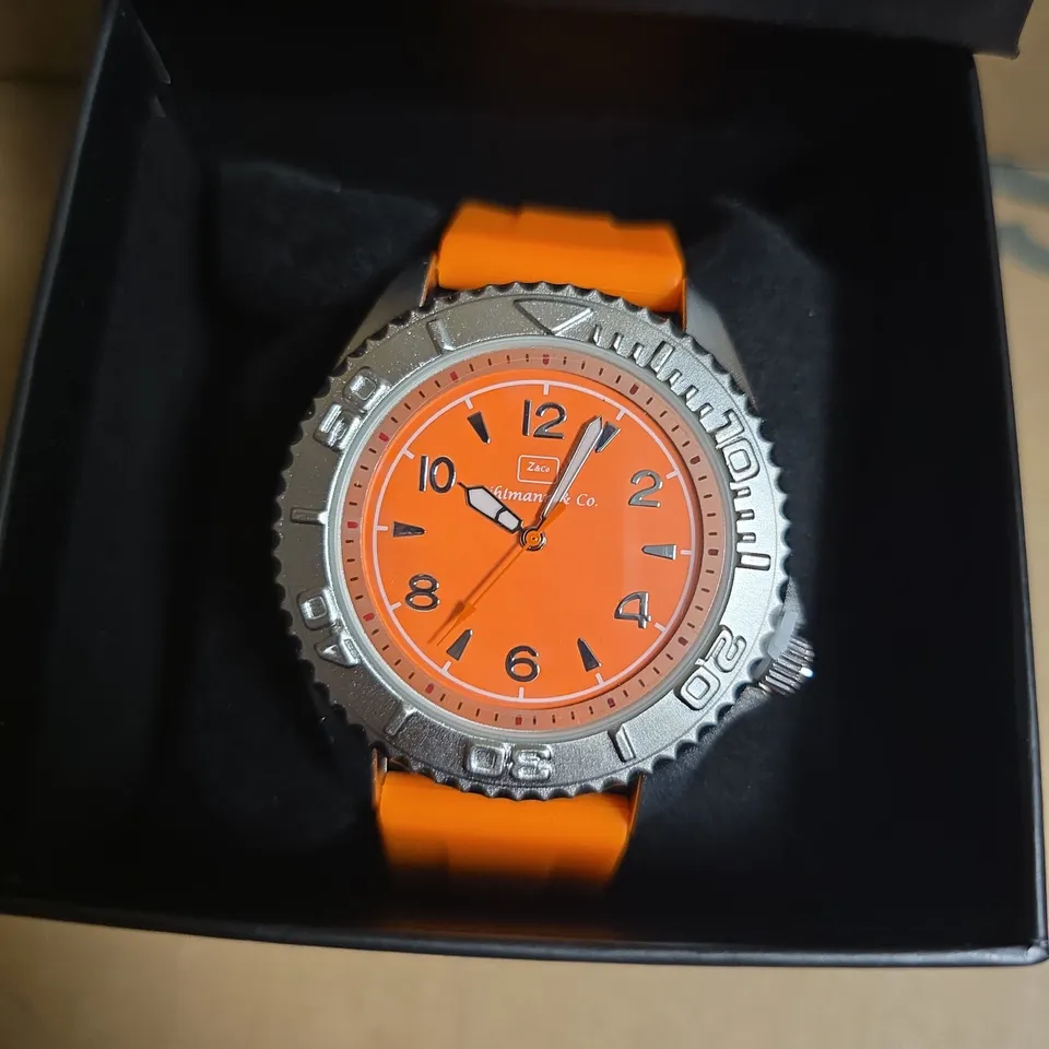 ZIHLMANN & CO STAINLESS STEEL WATCH WITH ORANGE FACE & RUBBER STRAP