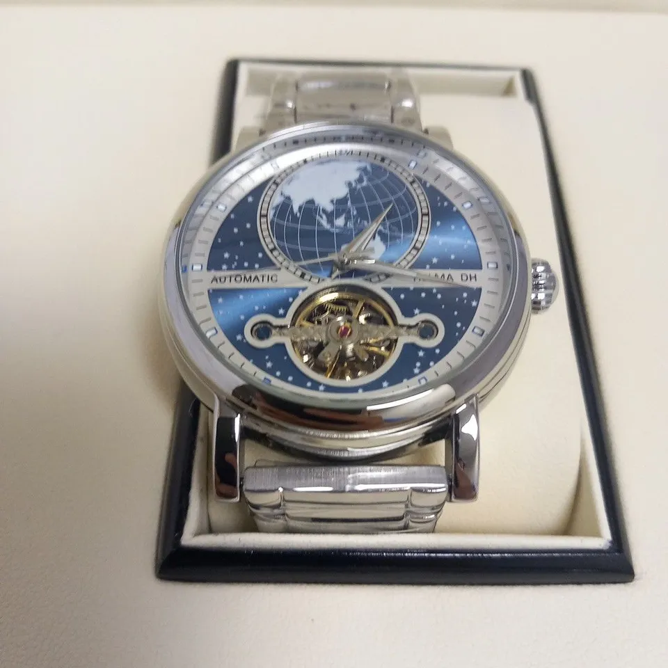 MEN’S HELMA DH AUTOMATIC WORLD VIEW WATCH – TOURBILLON MOVEMENT – BLUE DIAL – STAINLESS STEEL STRAP – GLASS EXHIBITION BACK CASE – LEATHER STRAP INCLUDED 