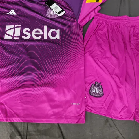 ADIDAS NEWCASTLE UNITED FOOTBALL KIT IN PINK/PURPLE SIZE MEDIUM