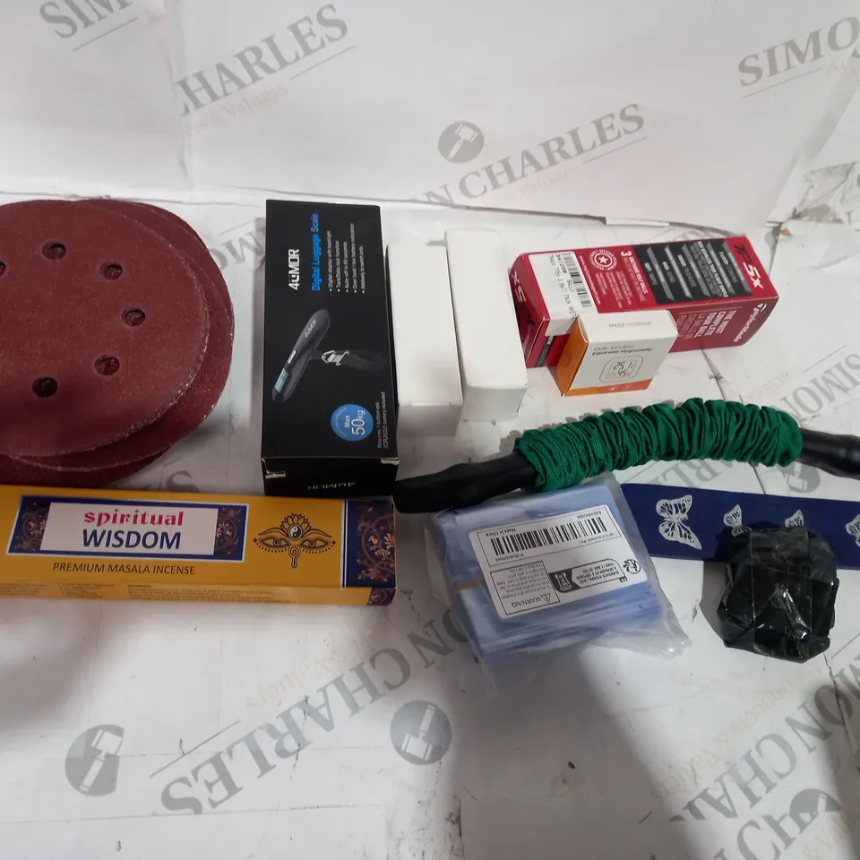 TOTE OF APPROXIMATELY 15 ASSORTED HOUSEHOLD  ITEMS TOO INCLUDE SANDPAPER , LUGGAGE SCALE , GOLF BALLS