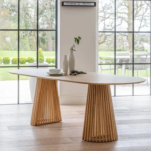 BOXED LAURA JAMES WILLOW 240CM OVAL DINING TABLE - PALE OAK (1 BOX)