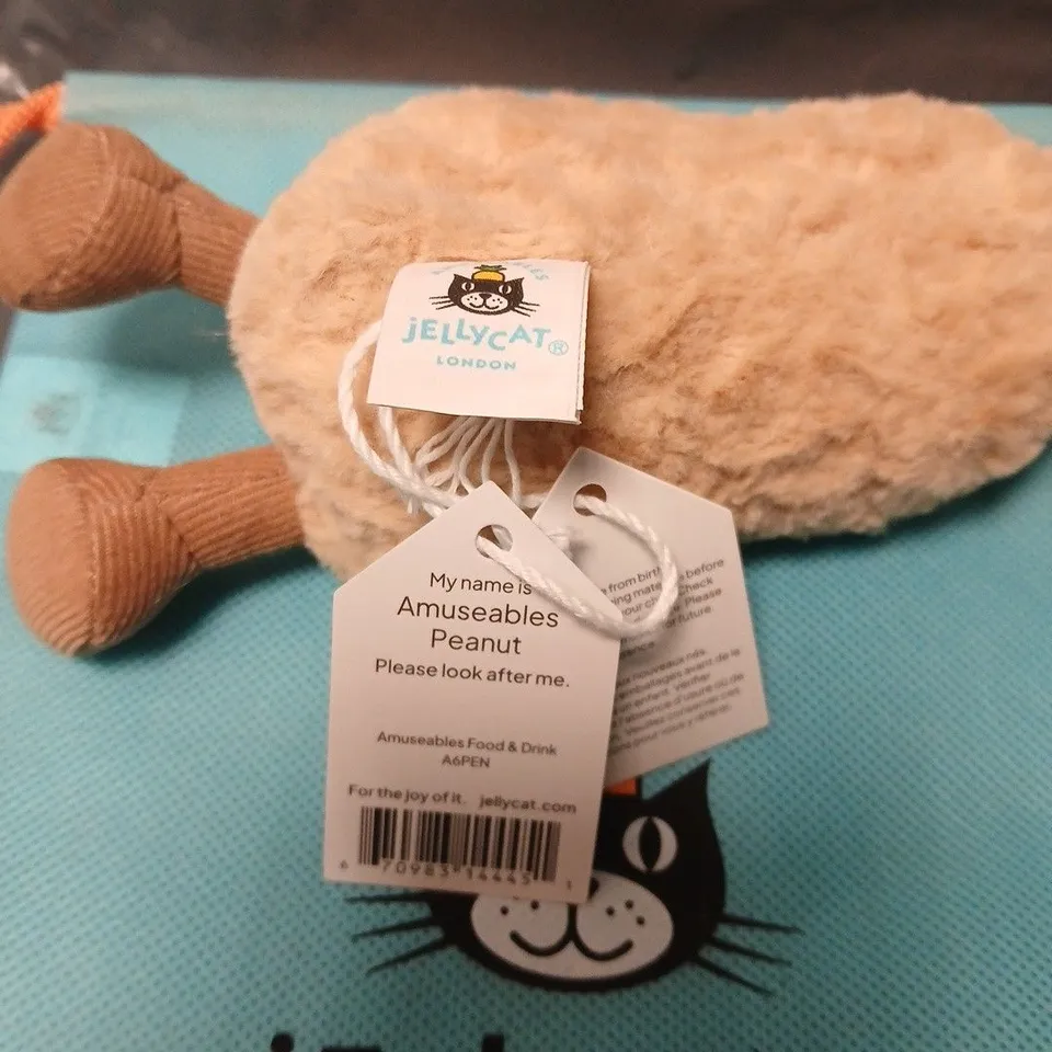 JELLYCAT AMUSEABLES PEANUT PLUSH TOY – BEIGE WITH BROWN FEET, TAG ATTACHED