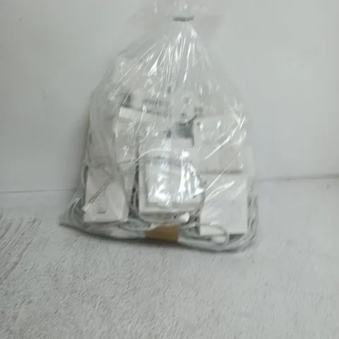 a bag containing a large amount of apple products including earphones, wires, plugs etc.