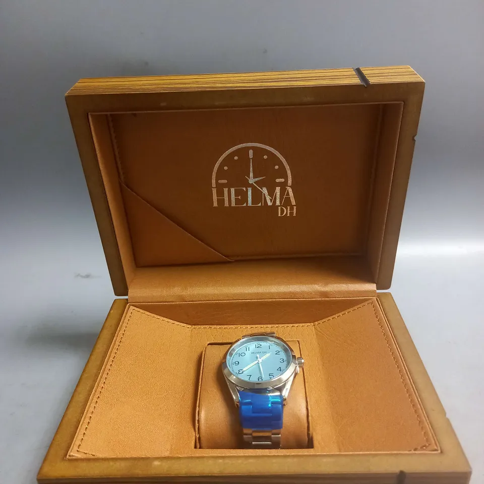 BOXED HELMA DH WATCH WITH PALE BLUE FACE IN SILVER