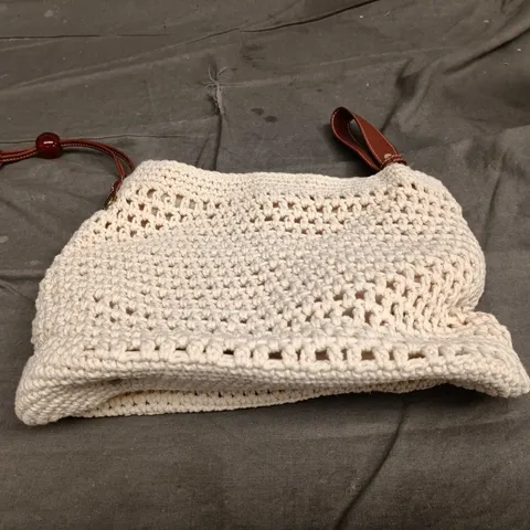 Beige crochet handbag with brown leather strap 