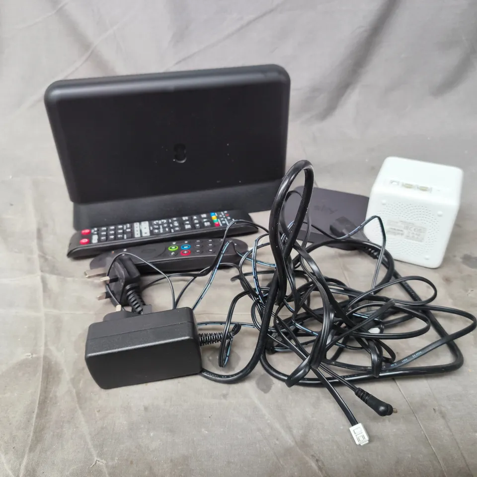 APPROXIMATELY 15 ASSORTED HOUSEHOLD PRODUCTS TO INCLUDE EE WIFI BOXES , SKY BOXES , TV REMOTES , ETC 