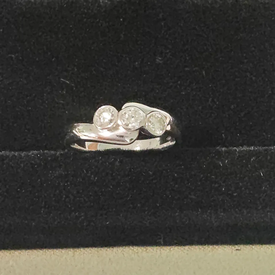 18CT WHITE GOLD THREE STONE RING SET WITH A NATURAL DIAMONDS WEIGHING +-0.42CT