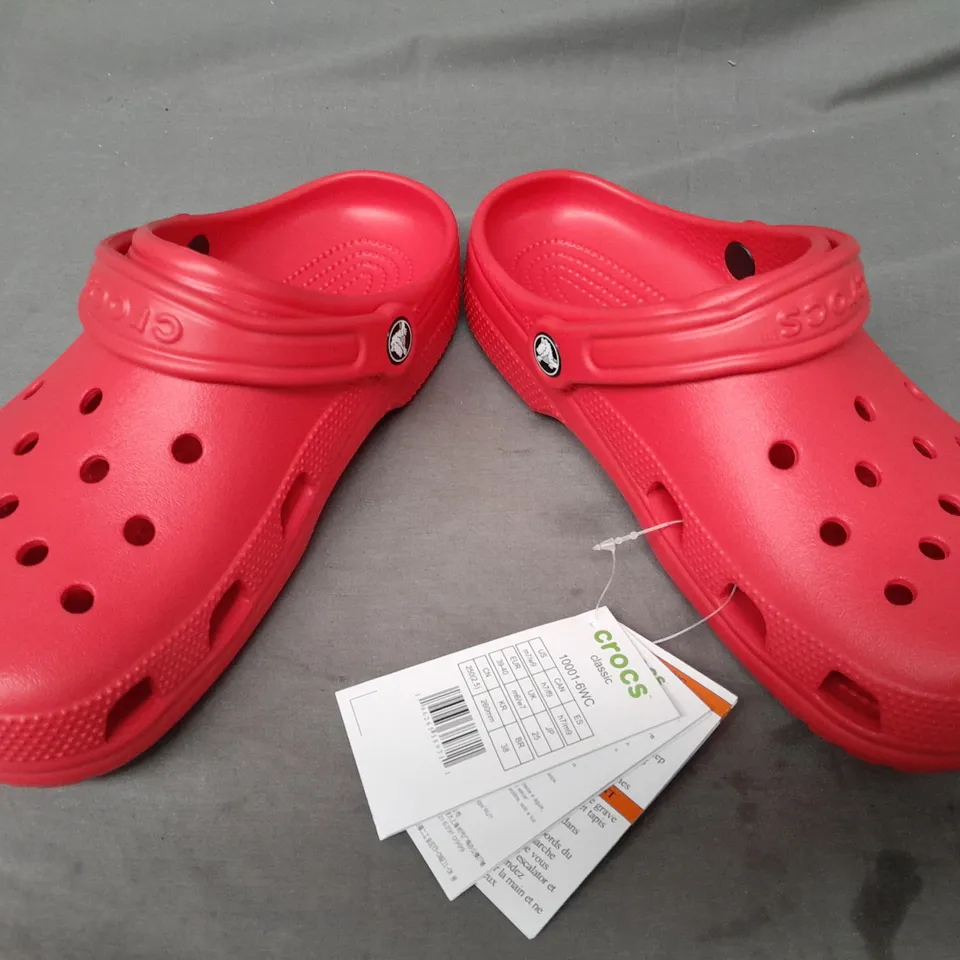 PAIR OF CROCS CLASSICS IN RED UK SIZE M6/W7