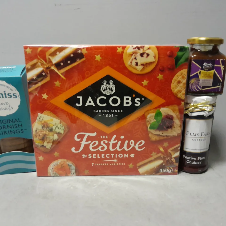 TOTE OF APPROXIMATELY 8 ASSORTED FOOD ITEMS TO INCLUDE - JACOBS FESTIVE SELECTION CRACKERS , CORNISH FAIRINGS , TASTE SPICED CHUTNEY ETC