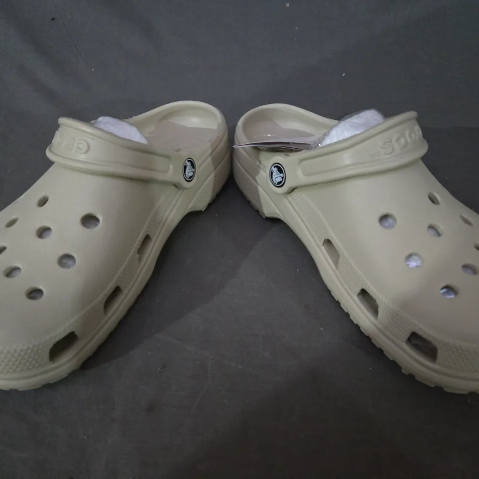 PAIR OF CROCS CLASSIC CLOGS IN BEIGE SIZE M5/W7