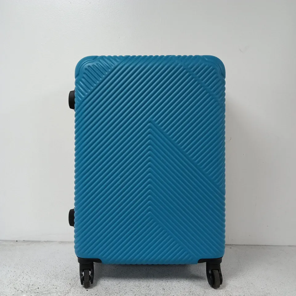 UNBRANDED BLUE HARD-SHELL WHEELED SUITCASE WITH DIAGONAL RIBBED PATTERN