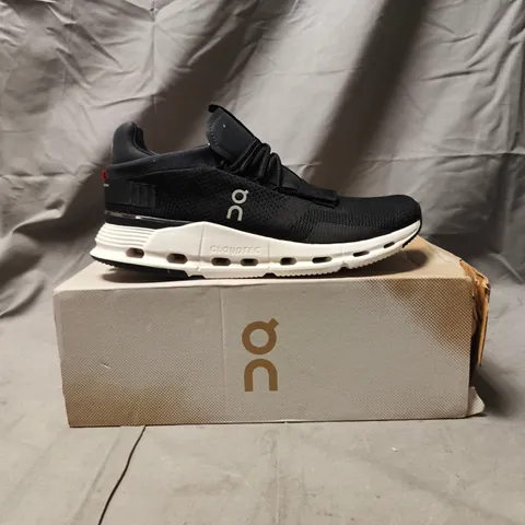 BOXED PAIR OF ON CLOUDNOVA SHOES IN PHANTOM/WHITE SIZE UK 7.5