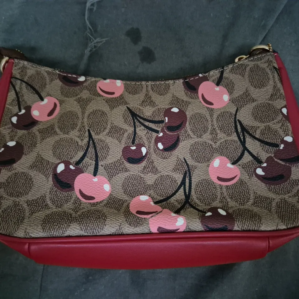 COACH HANDBAG – CHERRY PRINT CANVAS WITH RED LEATHER TRIM