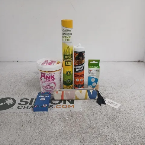 TOTE OF APPROXIMATELY 20 ASSORTED ITEMS TO INCLUDE TASSIMO DECALING TABLETS, PINK STUFF OXI POWDER, STAPLES, GORILLA ALL CONDITIONS SEALANT, CAROLINE GARDNER PENCIL CASE ETC