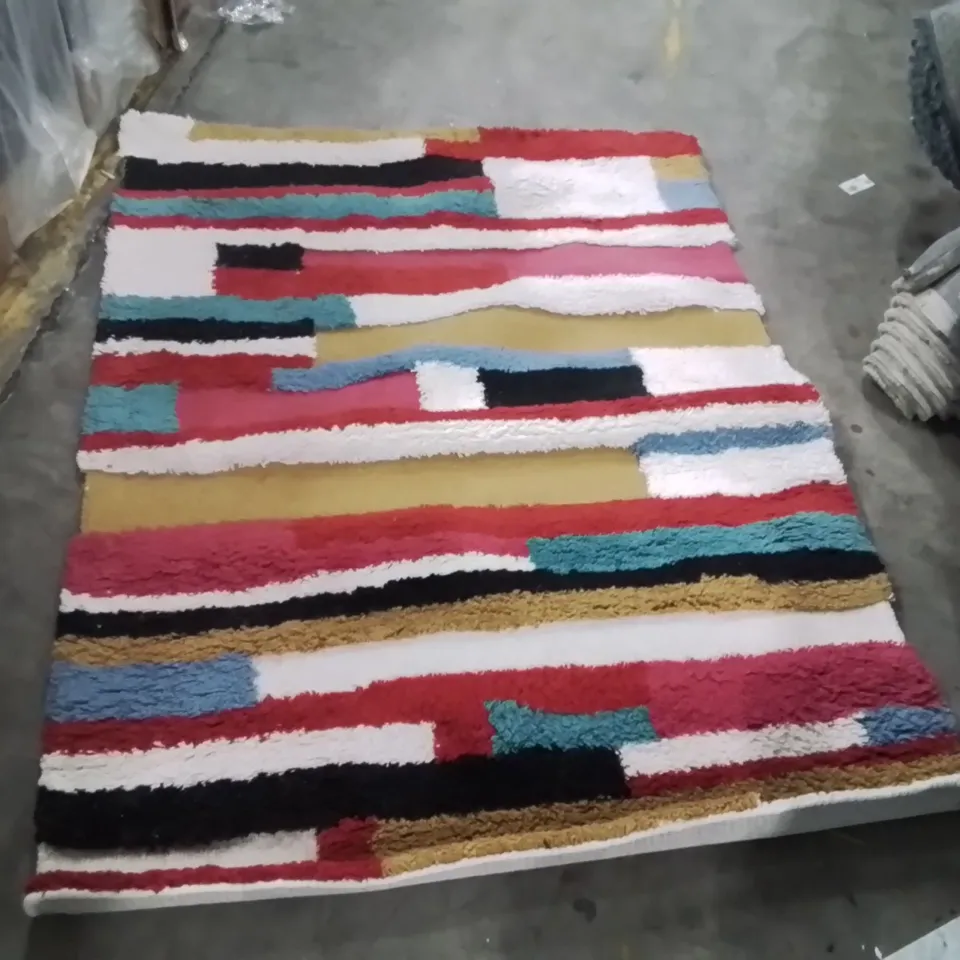 STILLAGE OF APPROXIMATELY 20 QUALITY DESIGNER RUGS