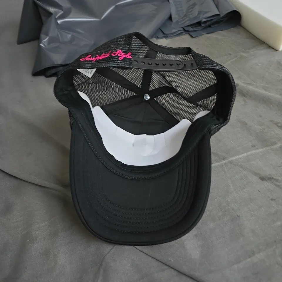 BLACK TRUCKER CAP WITH PINK EMBROIDERY – 'WRITE YOUR OWN SCRIPT' 