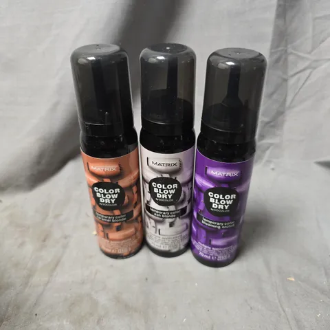 APPROXIMATELY 20 ASSORTED MATRIX BLOW DRY SPRAYS TO INCLUDE CARAMEL BLONDE, BLOOMING ORCHID, ASH BLONDE, ETC - COLLECTION ONLY