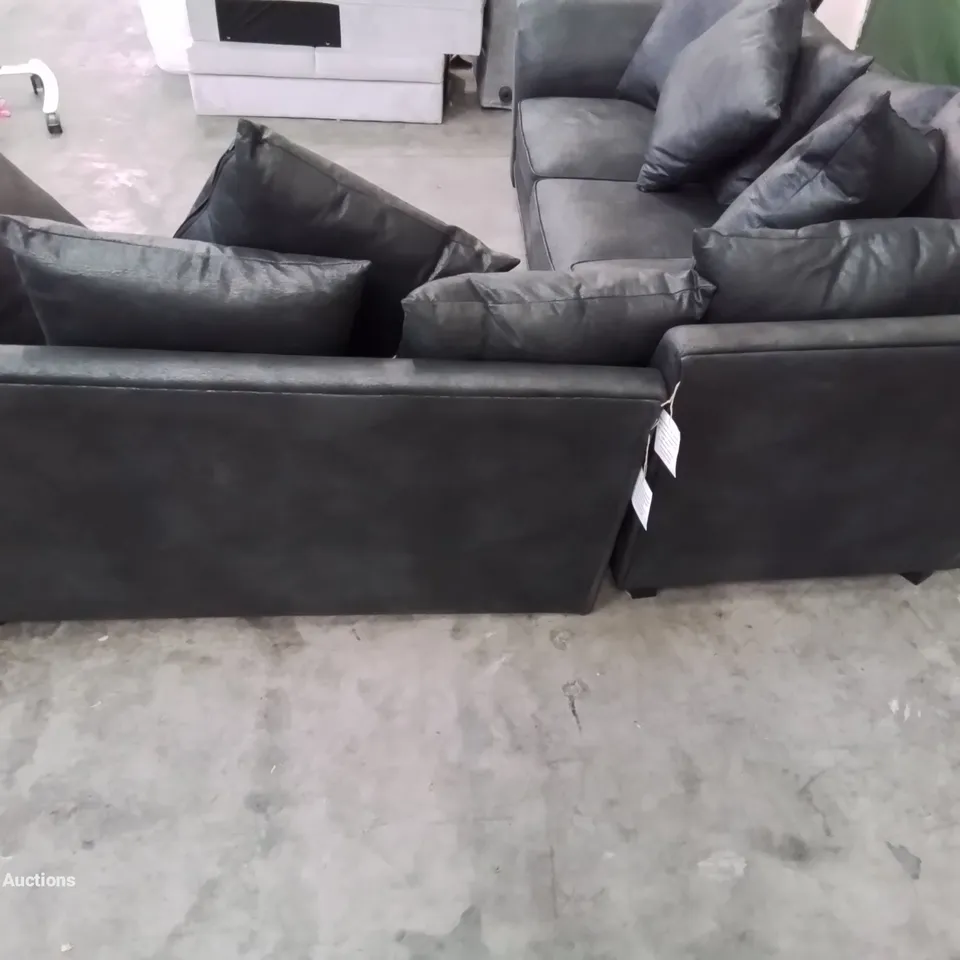 DESIGNER LEATHER LOOK FABRIC UPHOLSTERED CORNER SOFA IN BLACK HEAVILY DAMAGED AT REAR OF FRAME