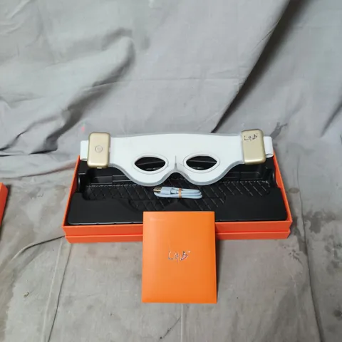 ELYSIUM SUPRA-ORBITAL FACE WEAR – WHITE MASK IN ORANGE BOX.