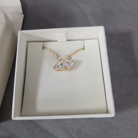 SWAROVSKI GOLD-TONE TWIN-HEART PENDANT NECKLACE WITH CLEAR STONES
