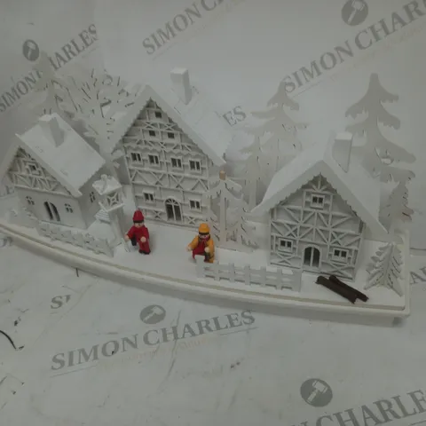 WHITE WOOD LIT VILLAGE SCENE