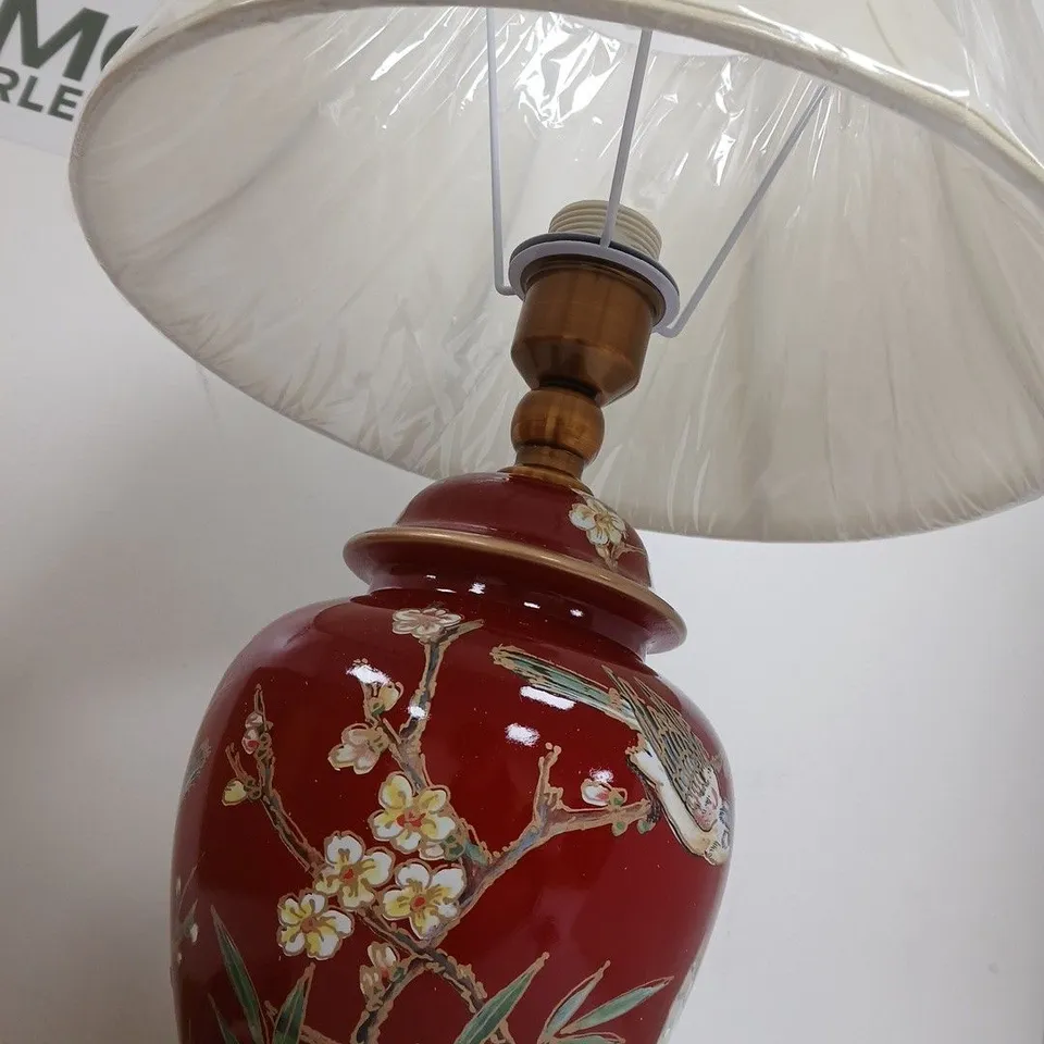 PORCELAIN TABLE LAMP WITH RED GLAZE, BIRD & BLOSSOM MOTIF; BRASS BASE; FABRIC SHADE