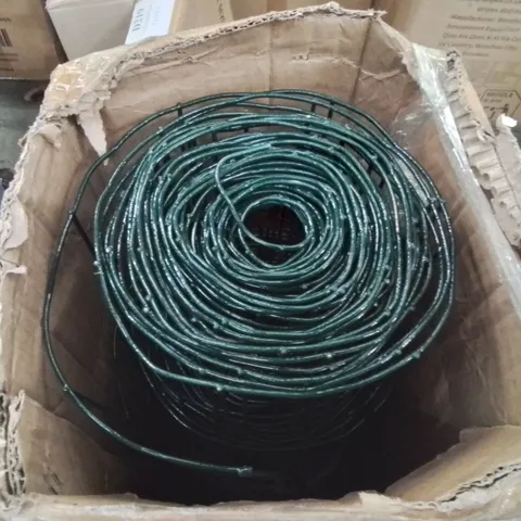 BOX CONTAINING LARGE ROLL OF METAL FENCING/CHICKEN WIRE