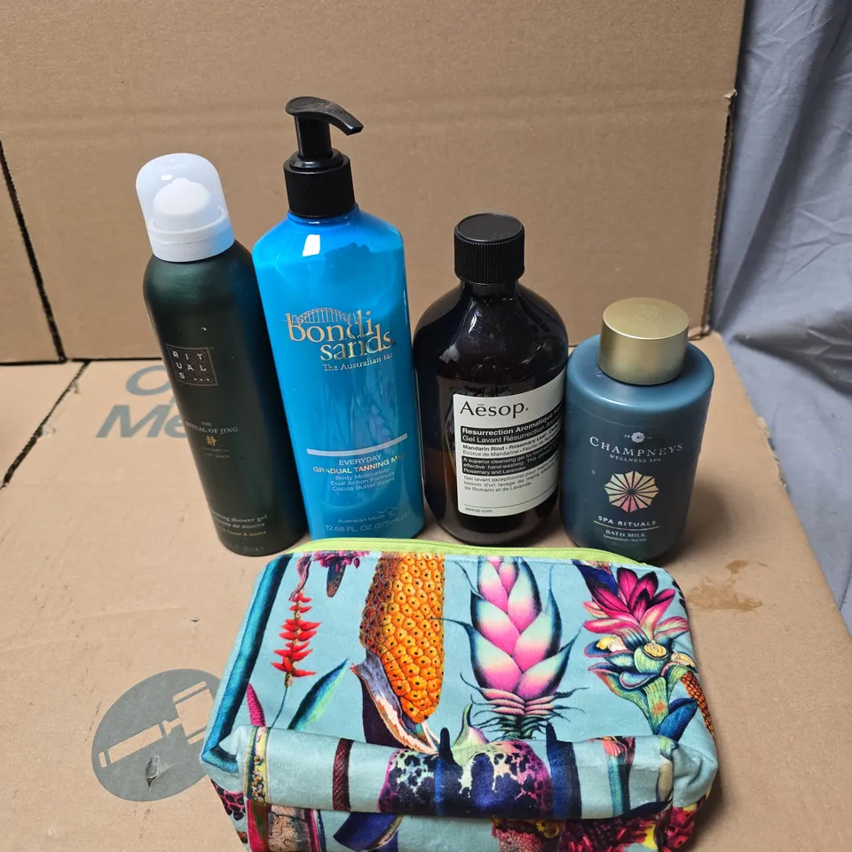 TOTE OF APPROXIMATELY 20 ASSORTED COSMETIC ITEMS TO INCLUDE BONDI SANDS TANNING MILK, AESOP, CHAMPNEYS BATH MILK, RITUALS...SHOWER GEL ETC