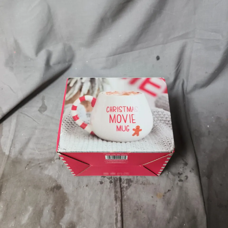 BOX OF APPROXIMATELY 20 ASSORTED HOUSEHOLD ITEMS INCLUDING CHRISTMAS MOVIE MUG , DAWN CHORUS TEA TOWEL AND NECK PILLOW 