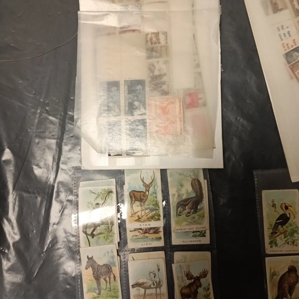 BOX OF APPROXIMATELY 50 ASSORTED STAMPS