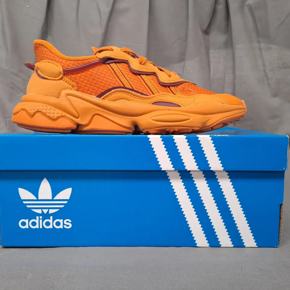 BOXED PAIR OF ADIDAS OZWEEGO SHOES IN ORANGE UK SIZE 6