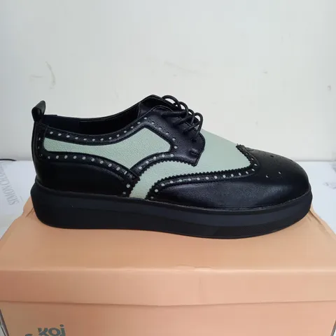 BRAND NEW BOXED PAIR OF KOI VEGAN LEATHER CORSON GREEN BROGUE DETAIL TRAINERS IN BLACK UK SIZE 8