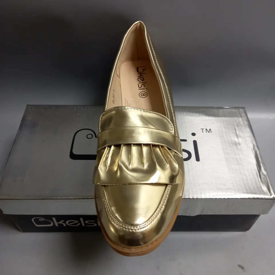 BOXED KELSI LADIES FLAT GOLD BROGUES. SIZE 8