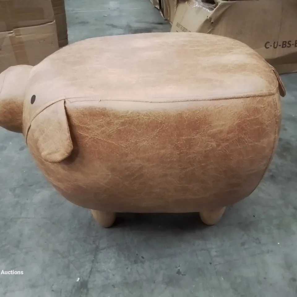 A FAUX LEATHER UPHOLSTERED PIGGY POUFFE 