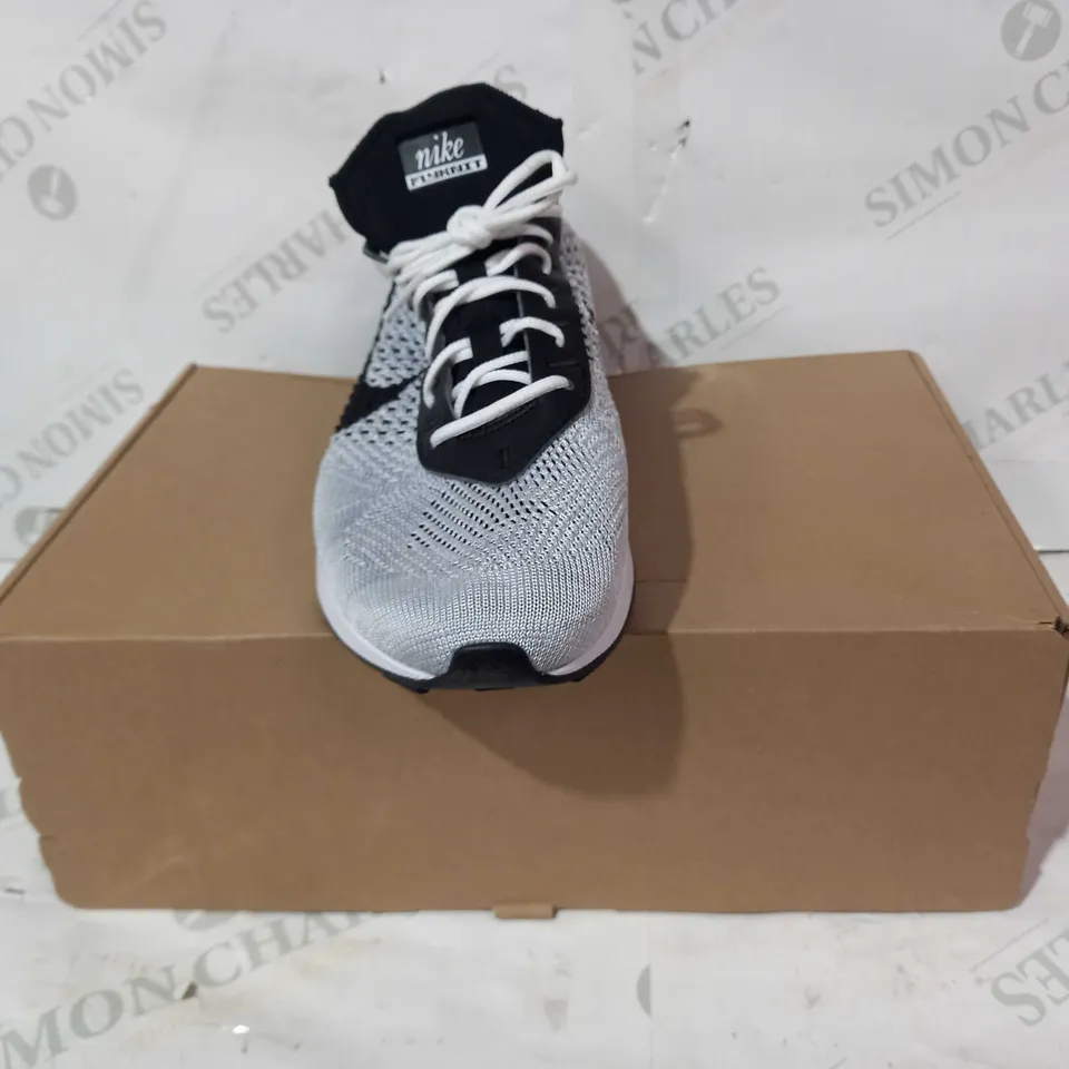 BOXED PAIR OF NIKE FLYKNIT SHOES IN WHITE/BLACK UK SIZE 7