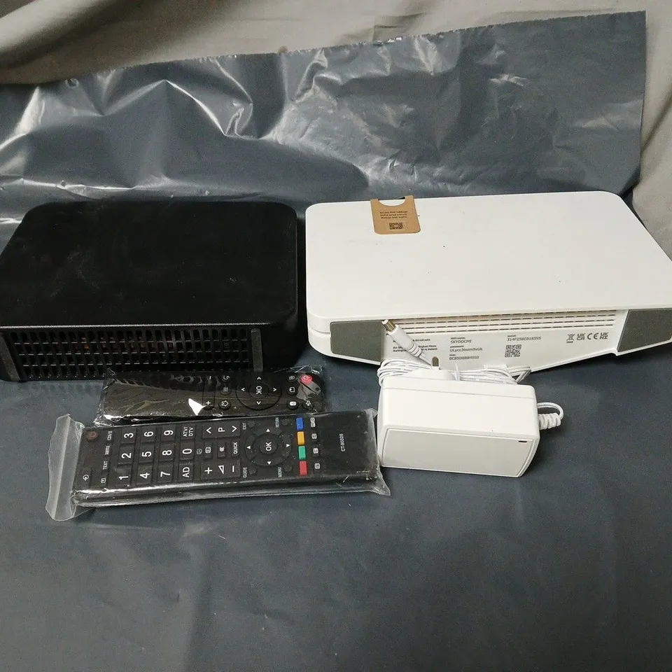 APPROXIMATELY 18 ASSORTED HOUSEHOLD ITEMS TO INCLUDE ROUTERS, REMOTE CONTROLS, PLUGS ETC