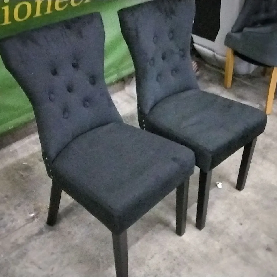 SET OF 2 PLUSH BLACK FABRIC BUTTONBACK DINING CHAIRS WITH KNOCKER BACKS AND BLACK WOODEN LEGS