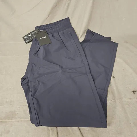 ARNE ACTIVE TECHNICAL TAPERED TRACK PANT IN NAVY SIZE S