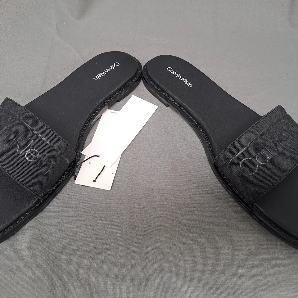 BOXED PAIR OF CALVIN KLEIN FLAT SLIDERS IN BLACK UK SIZE 6